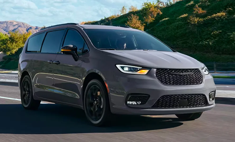 The 2024 Chrysler Pacifica driving on a rural highway