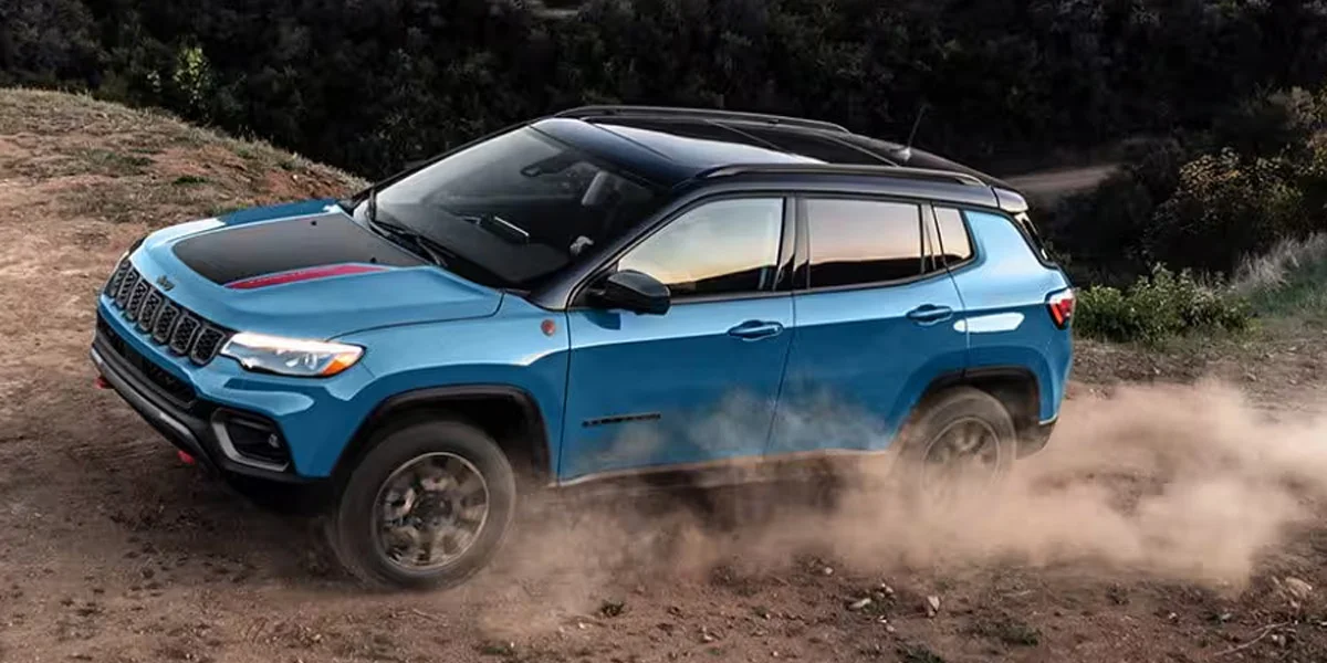 The 2025 Jeep Compass kicking up some dust while off-roading